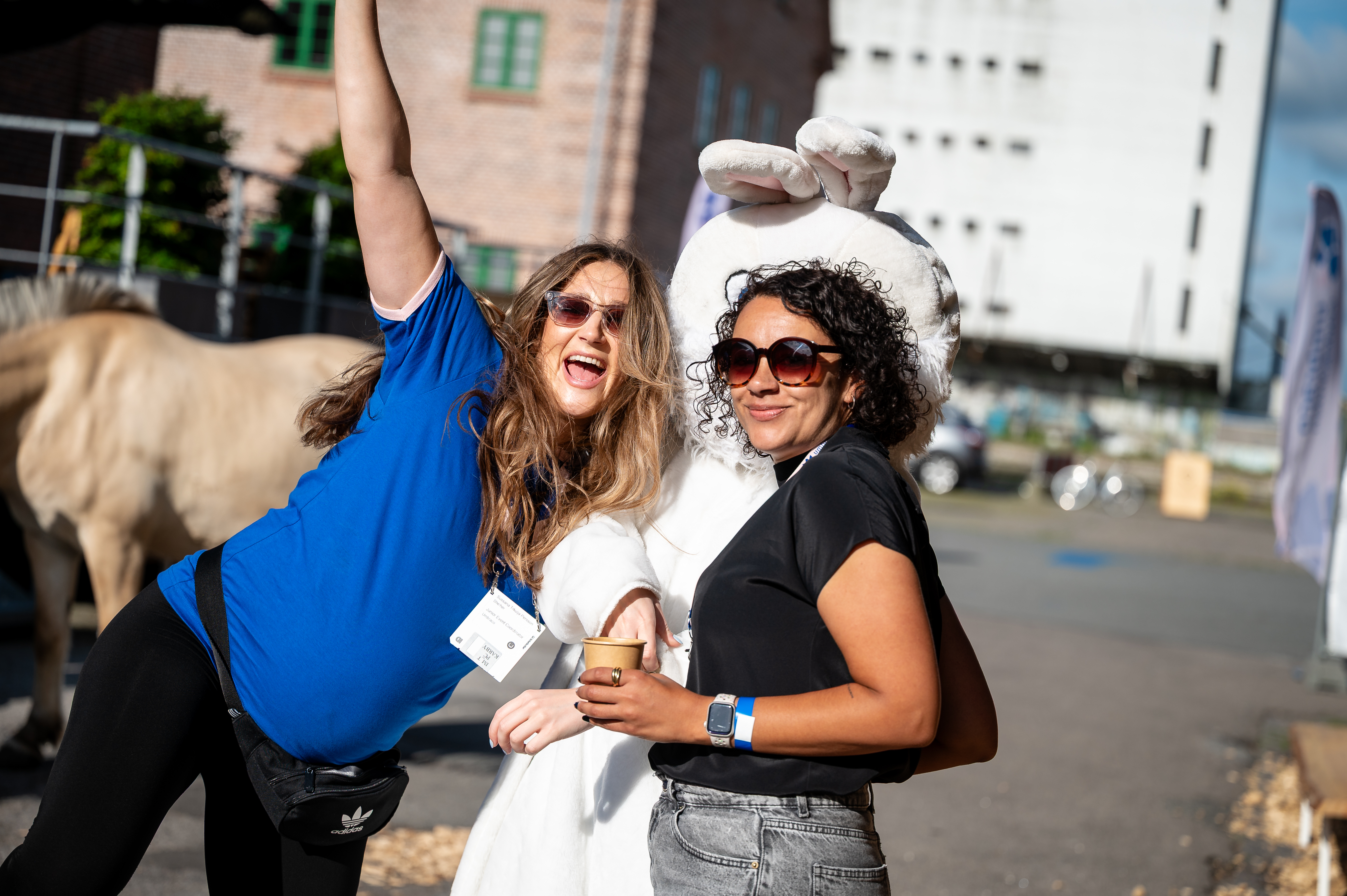 Two women hugging the rabbit outside of the Codegarden venue