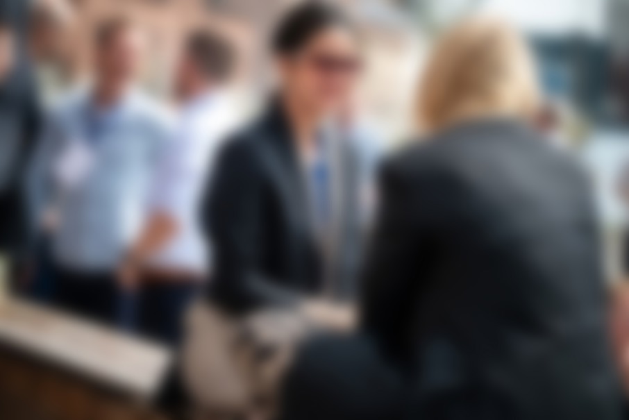 Two business women are speaking to each other at Codegarden