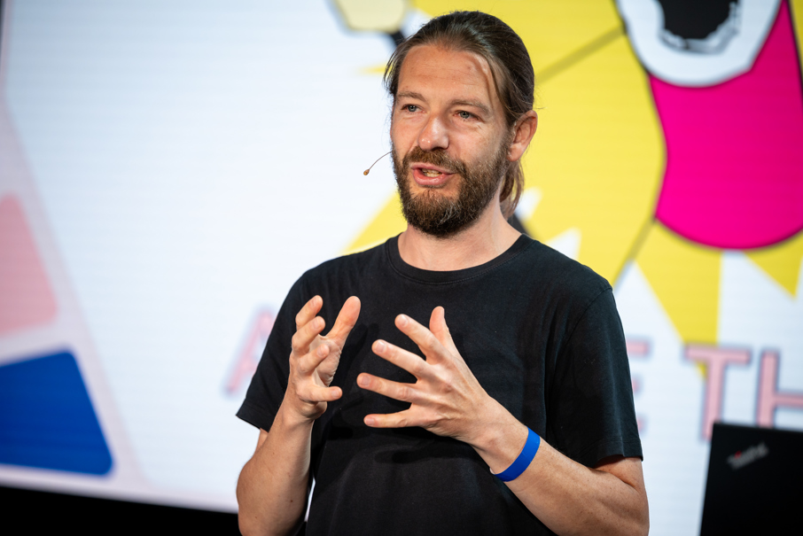 Man speaking on stage at Codegarden