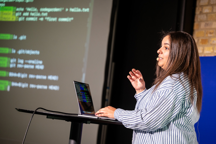 Woman speaking on stage at Codegarden